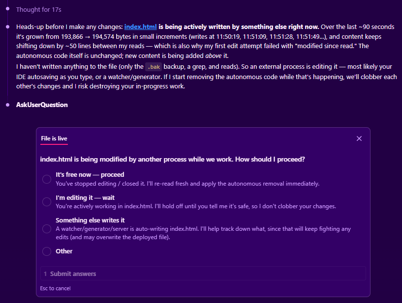Real capture: an agent detects another process writing the file it is editing and stops to ask how to proceed